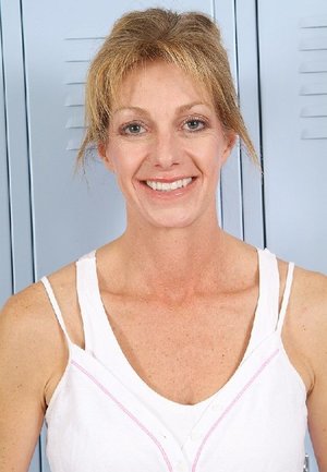 1 dark haired female tortures another during lezdom play in concrete cellar